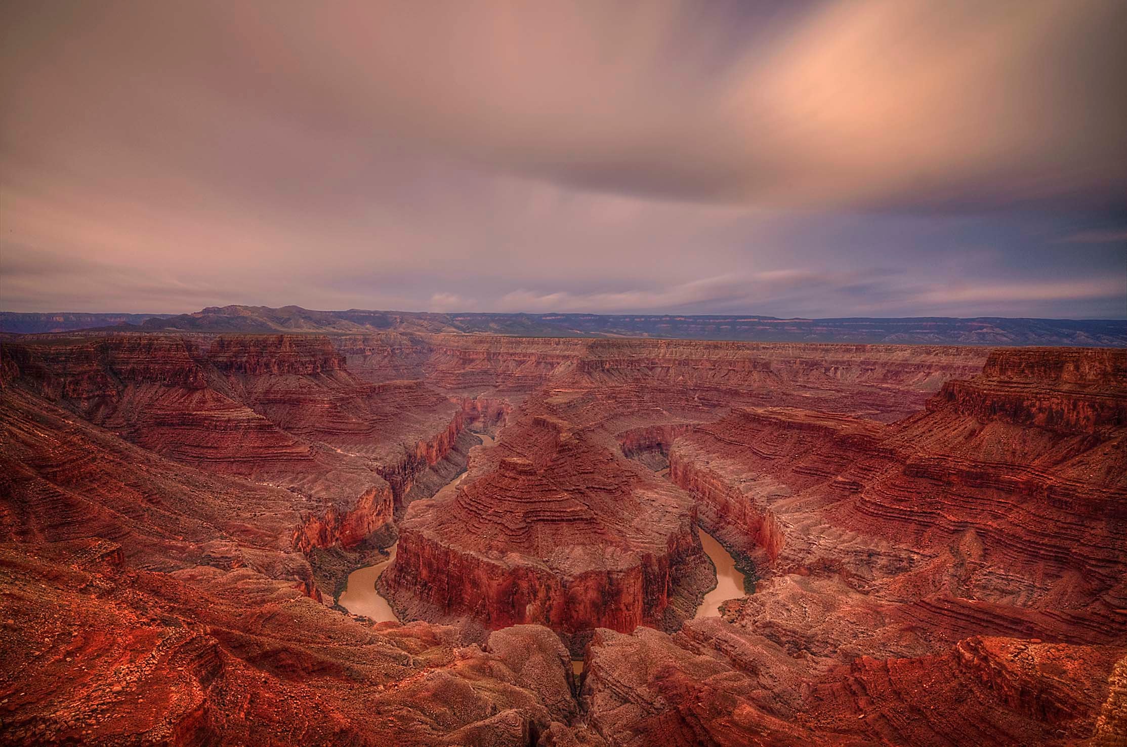 A windswept morning at Tatahatso Point, the San Juan River carving its ancient bend through red canyon walls below
