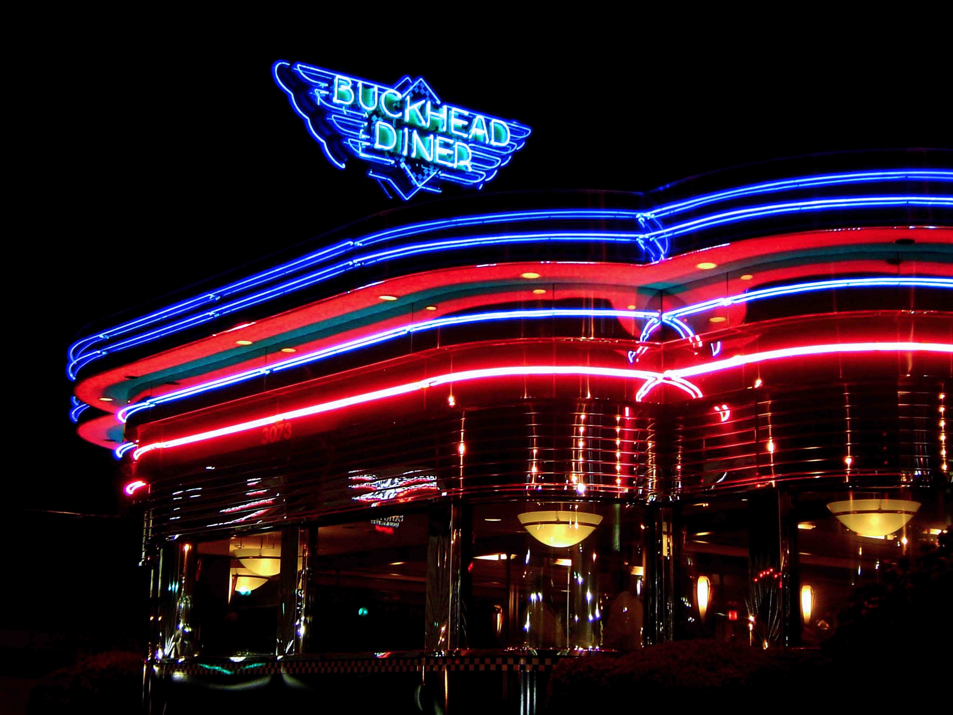 Buckhead Diner in Atlanta Georgia at night with vivid blue and red neon light trails