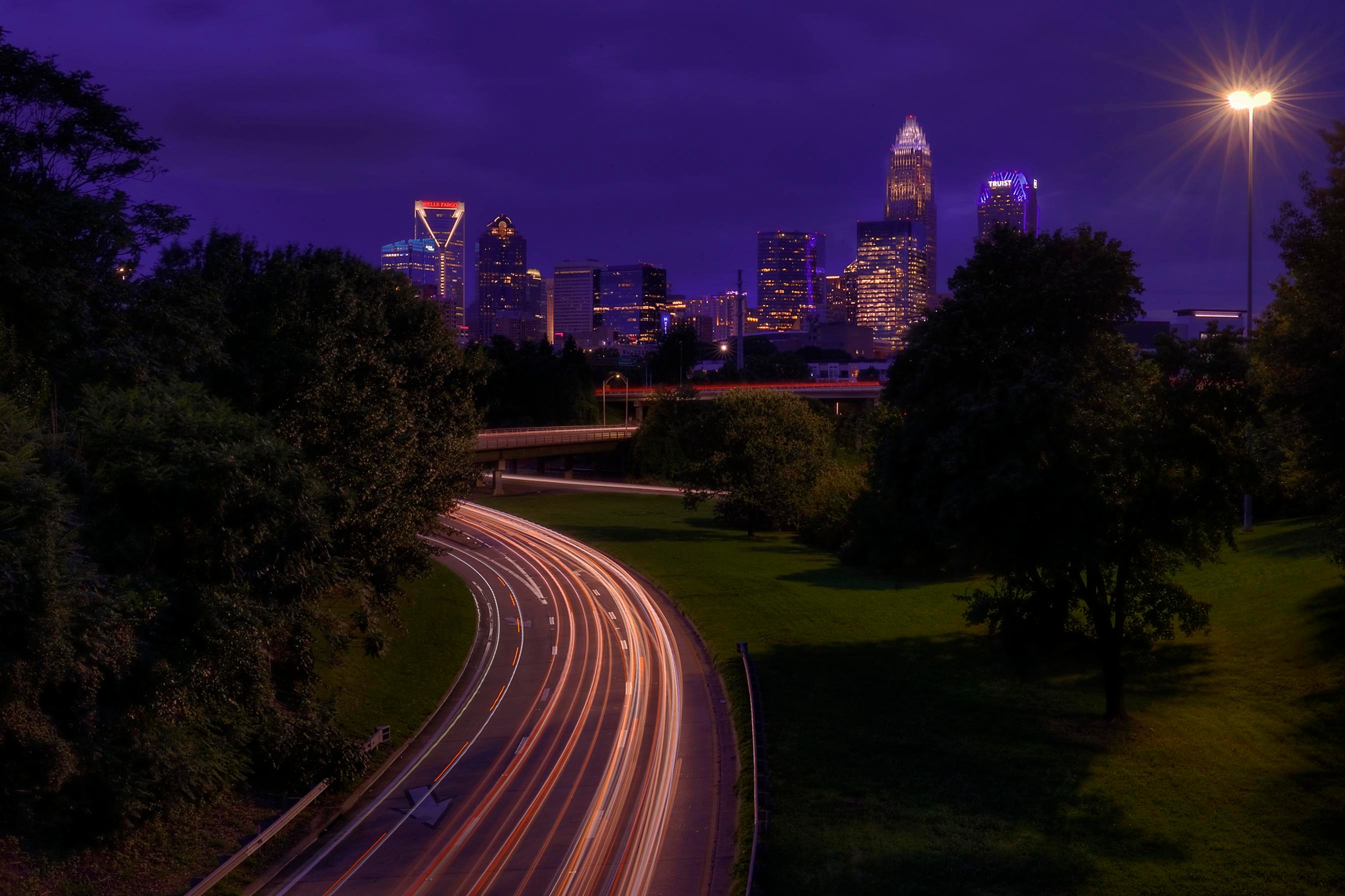 Urban night cityscape with light trails